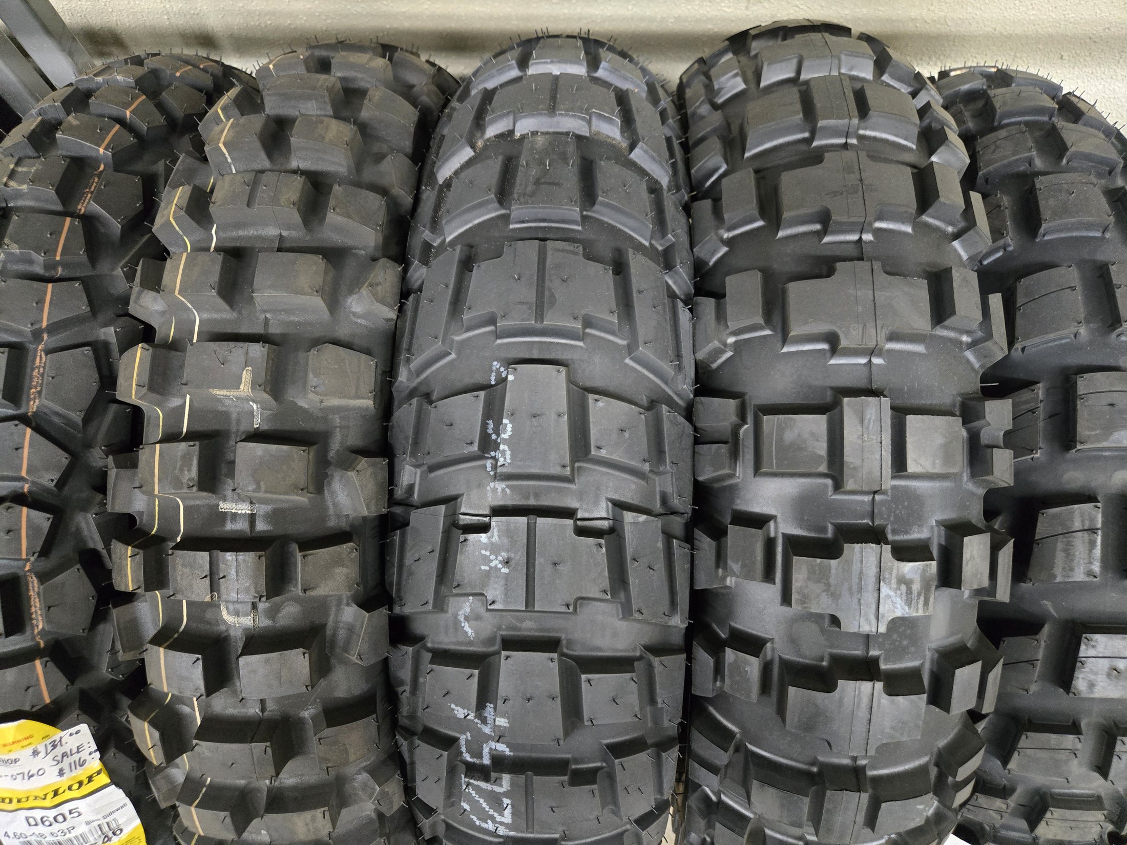 Close-up of a motorcycle tire tread pattern in stock at Rickie's Shop