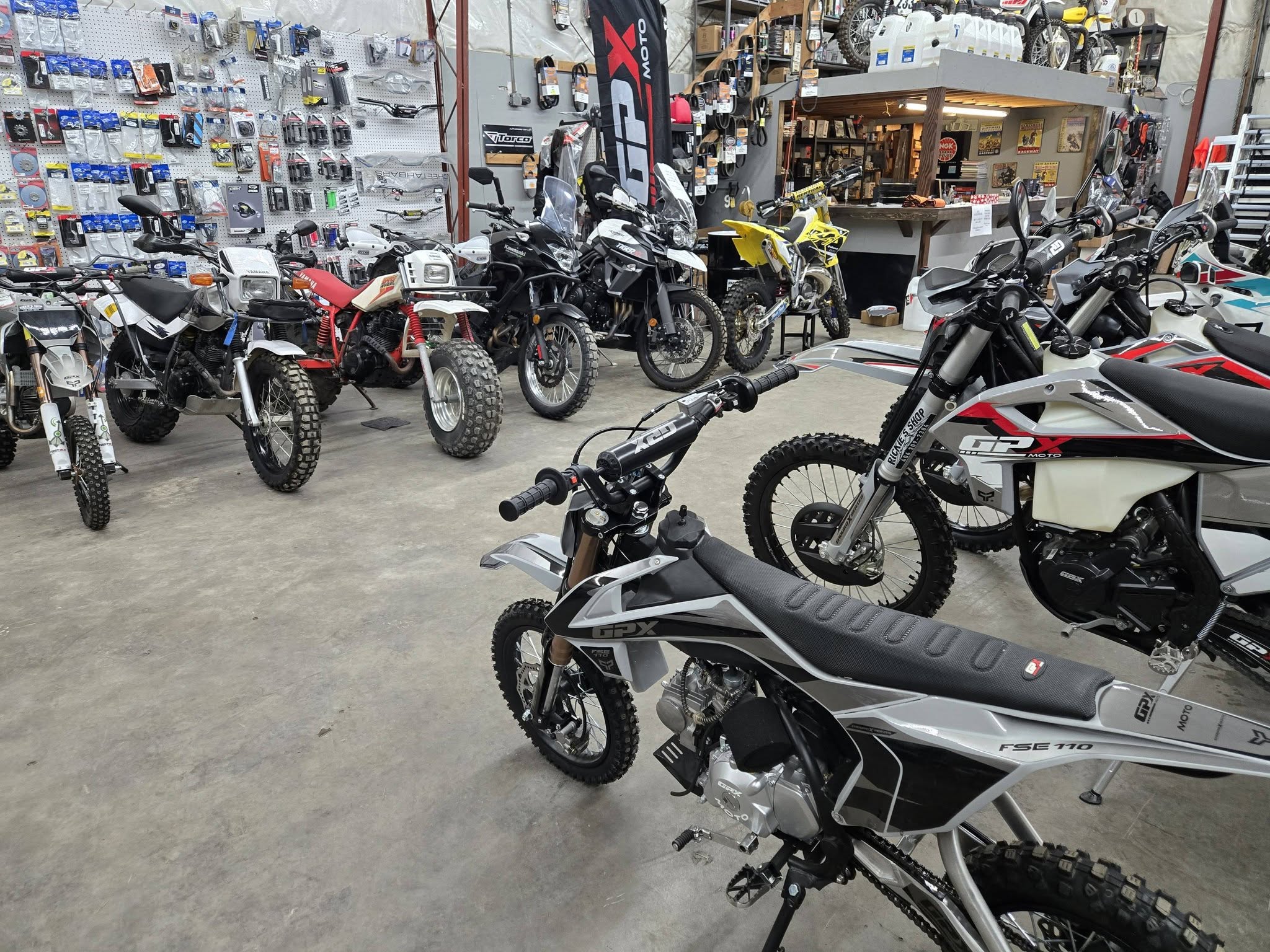 Interior of Rickie's Shop showing vintage and modern motorcycles